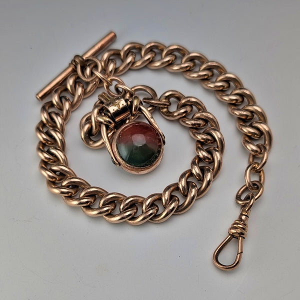 Antique British rolled gold Albert chain with two-tone swivel fob and natural stone.